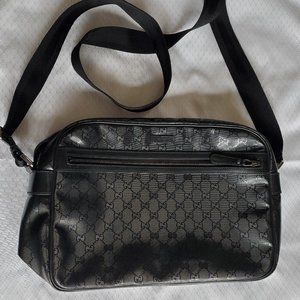 Black Gucci GG Embossed Shoulder Bag.
